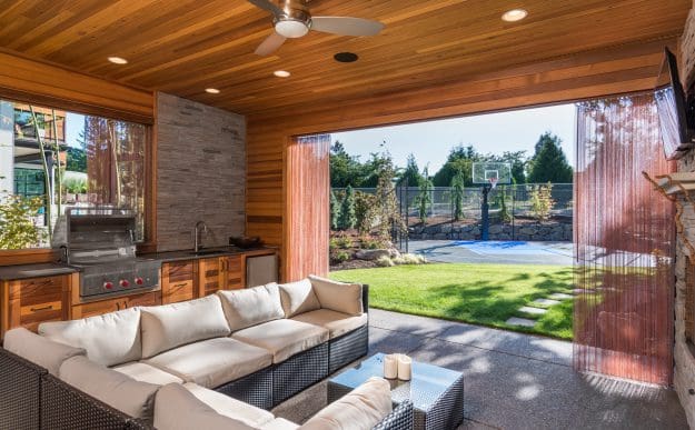 Outdoor kitchen with a Fireplace
