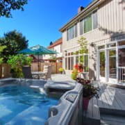 Backyard with hot tub and patio area