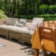Cute sunny terrace in the green garden of trendy estate