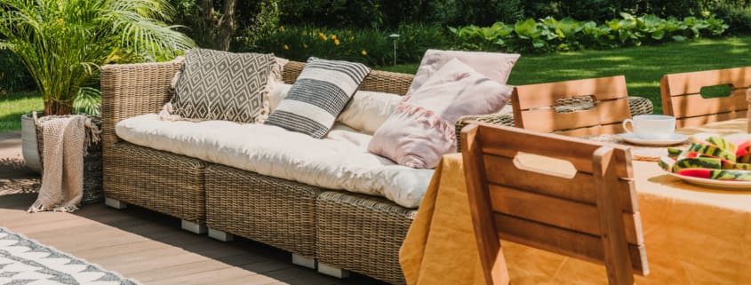 Cute sunny terrace in the green garden of trendy estate