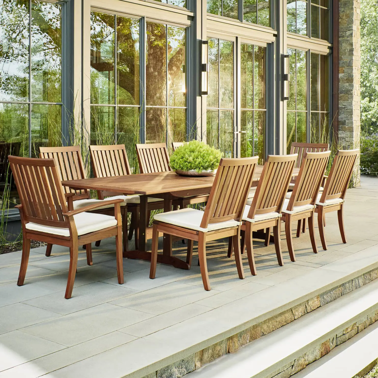 Elegant wooden dining set with cushioned chairs on a modern patio, ideal for those searching for Patio Furniture near me.